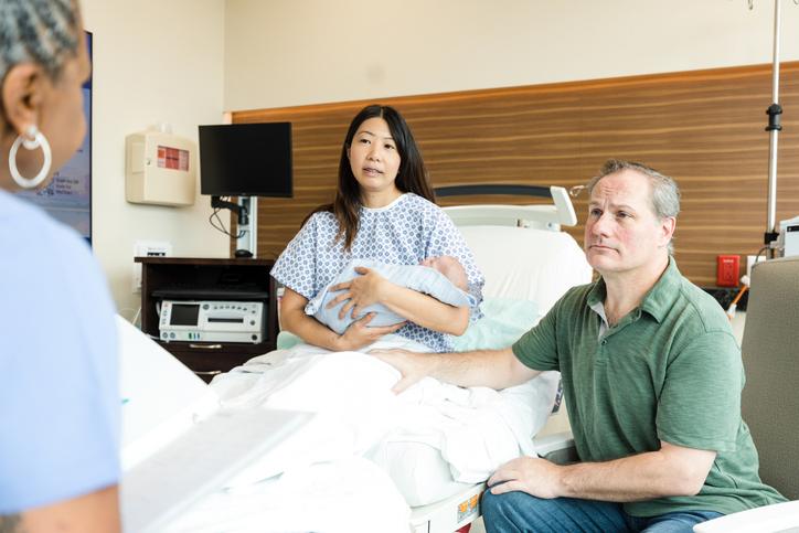 Newborn Baby with Parents in Hospital Room Newborn Baby with Parents in Hospital Room