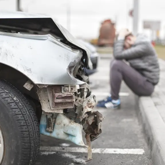 Broken car after the accident in foreground