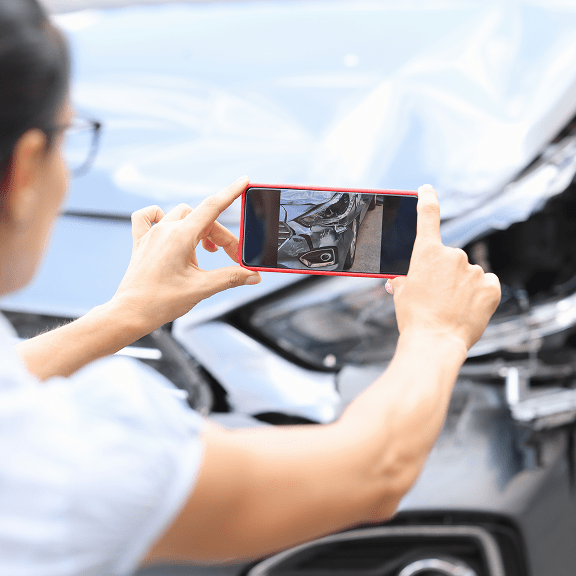 Person taking picture of the car crash