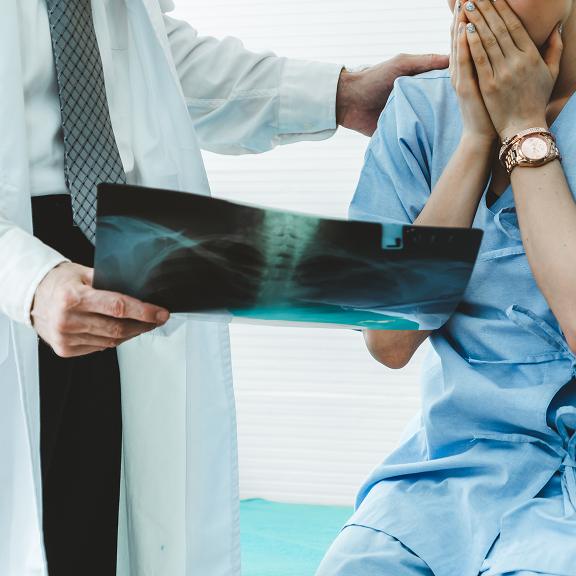 woman is shocked after seeing x-ray scan.