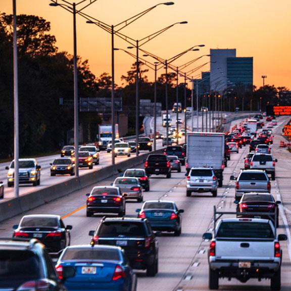 Cars in a highway with a landscape view of Jacksonville Cars in a highway with a landscape view of Jacksonville